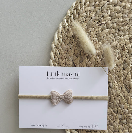Ontdek de stijlvolle baby haarband met beige strik bij Littlemay.nl