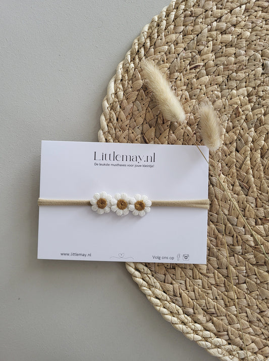 Ontdek de stijlvolle babyhaarband met gele bloemen bij Littlemay.nl