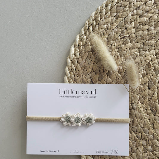 Ontdek de stijlvolle babyhaarband met groene bloemen bij Littlemay.nl